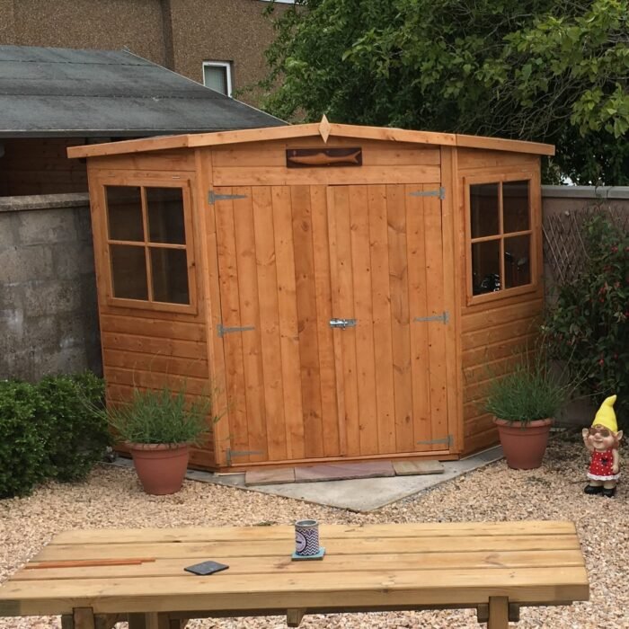 5060490130231CornerShed_1c158686-25e9-491a-9e18-0b529b4c4ddb-700x700-1.jpg Shire 7ft x 7ft Corner Pressure Treated Shed - Image 1